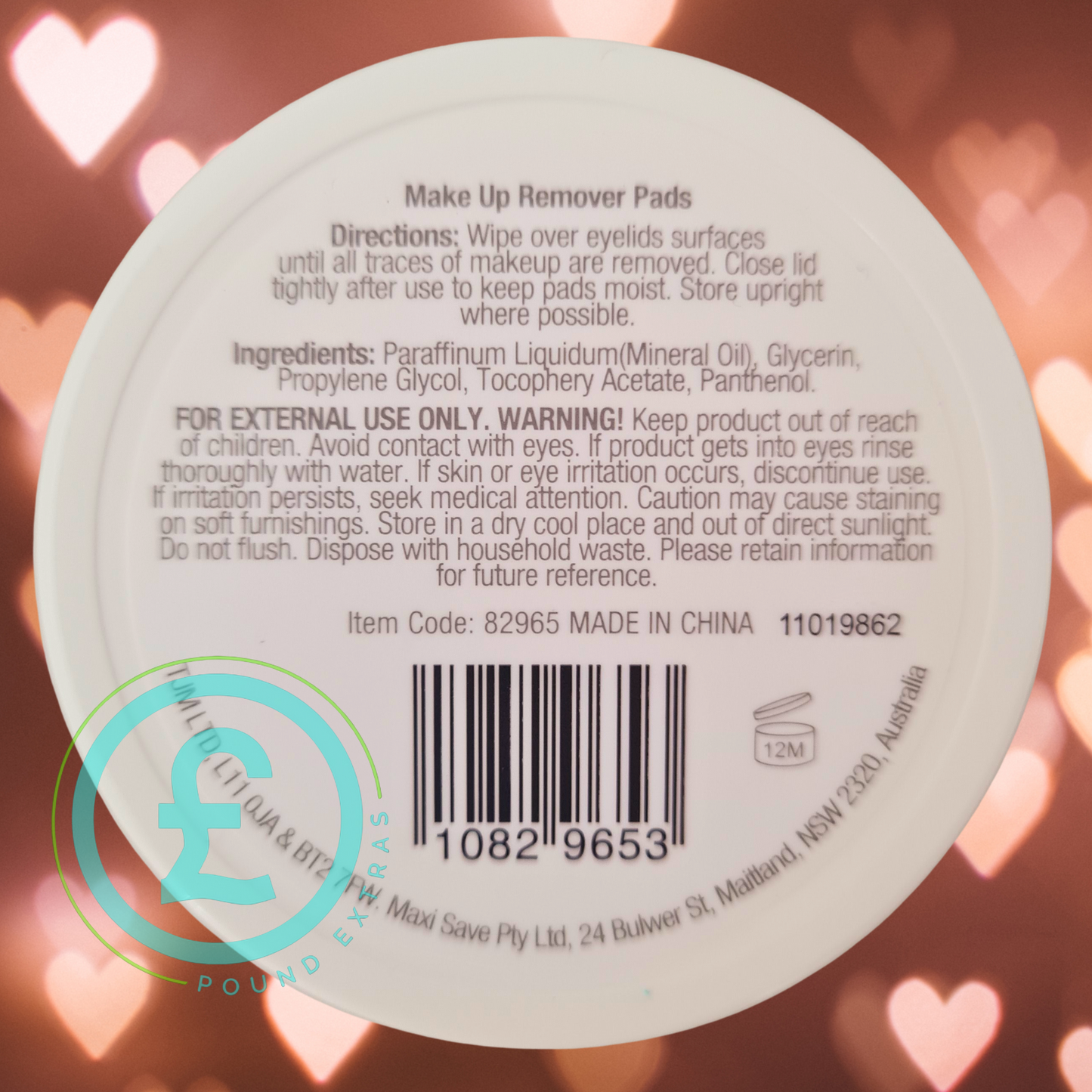 Makeup remover pad with label and barcode on a blurred heart-shaped light background