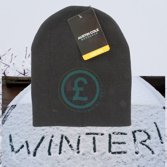 Black beanie with a brand tag on a snow-covered surface with 'WINTER!' written in the snow.