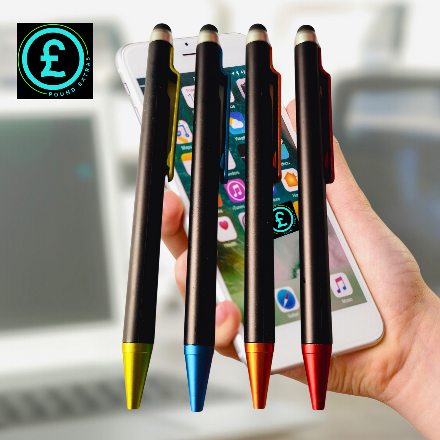 Four stylus pens with colored tips held over a smartphone.