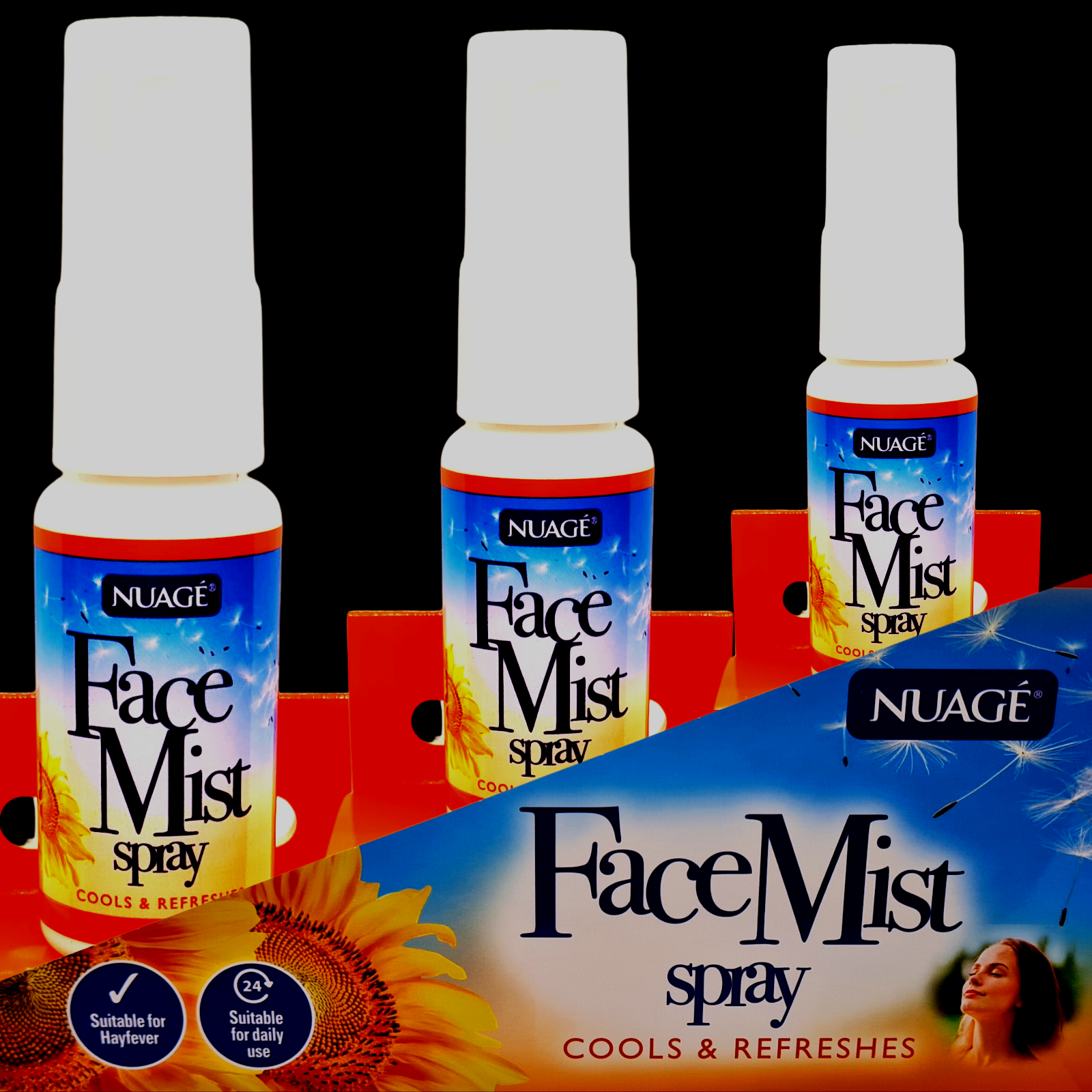 Three bottles of Nuage Face Mist spray on a black background with product packaging.